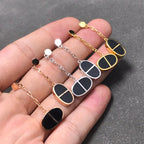 [Elowen jewels ]CHAINE VERSO OHRRINGE AUS SCHWARZER KERAMIK UND SILBER