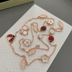 {
  "Elowen jewels": "Elowen Schmuck",
  "LUCKY SPRING 15 MOTIFS ROSE GOLD NECKLACE": "LUCKY SPRING HALSKETTE MIT 15 MOTIVEN IN ROSÉGOLD"
}