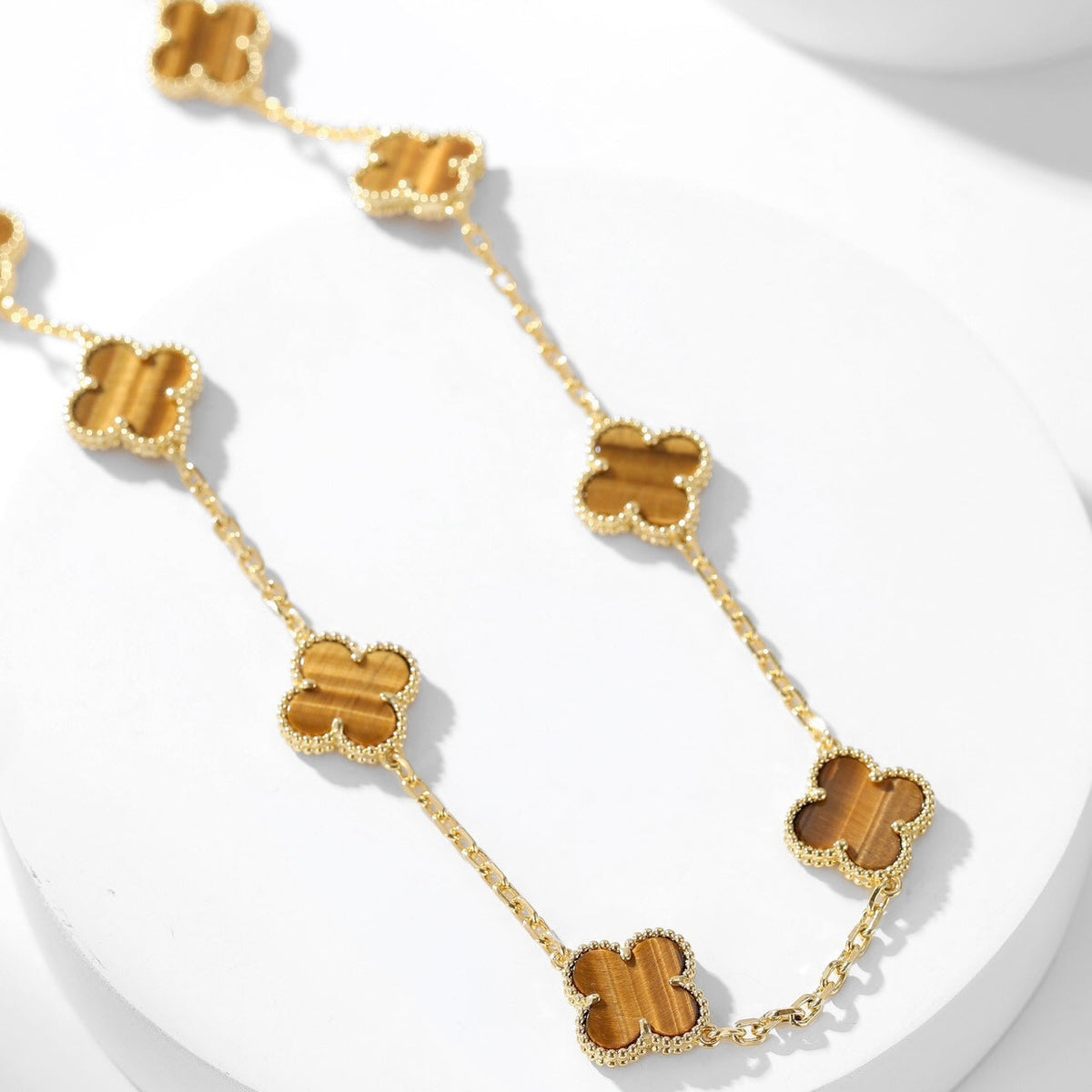 {
  "Elowen jewels": "Elowen jewels",
  "CLOVER 10 MOTIFS TIGER EYE NECKLACE": "クローバー 10モチーフ タイガーアイ ネックレス"
}