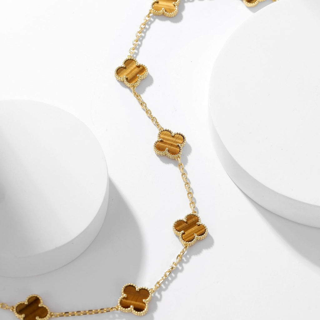 {
  "Elowen jewels": "Elowen jewels",
  "CLOVER 10 MOTIFS TIGER EYE NECKLACE": "クローバー 10モチーフ タイガーアイ ネックレス"
}