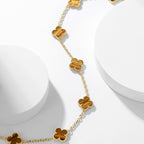 {
  "Elowen jewels": "Elowen jewels",
  "CLOVER 10 MOTIFS TIGER EYE NECKLACE": "クローバー 10モチーフ タイガーアイ ネックレス"
}