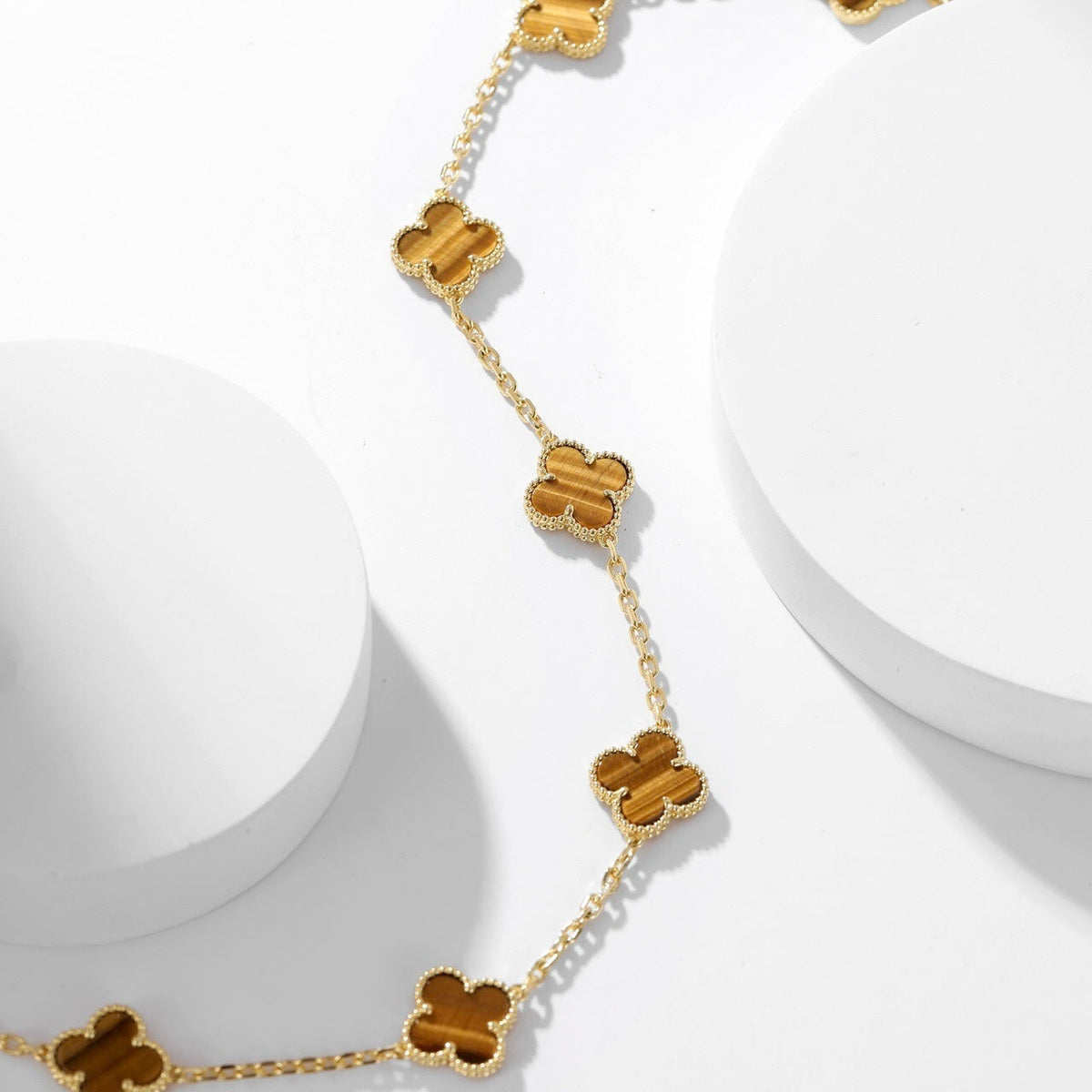 {
  "Elowen jewels": "Elowen jewels",
  "CLOVER 10 MOTIFS TIGER EYE NECKLACE": "クローバー 10モチーフ タイガーアイ ネックレス"
}