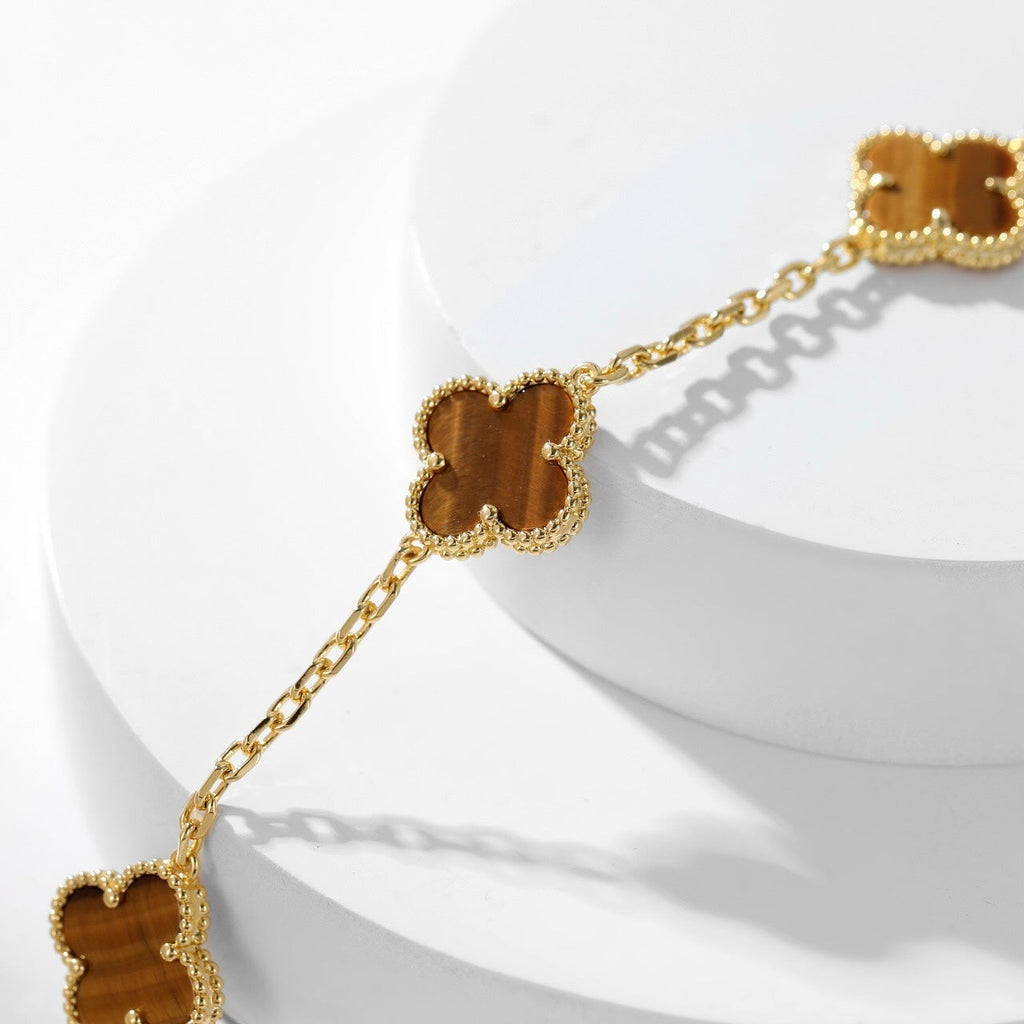 {
  "Elowen jewels": "Elowen jewels",
  "CLOVER 10 MOTIFS TIGER EYE NECKLACE": "クローバー 10モチーフ タイガーアイ ネックレス"
}