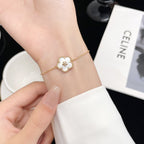 [Elowen jewels] ARMBAND MIT WEISSEM PERLMUTT-PFLAUMENBLÜTEN-MOTIV